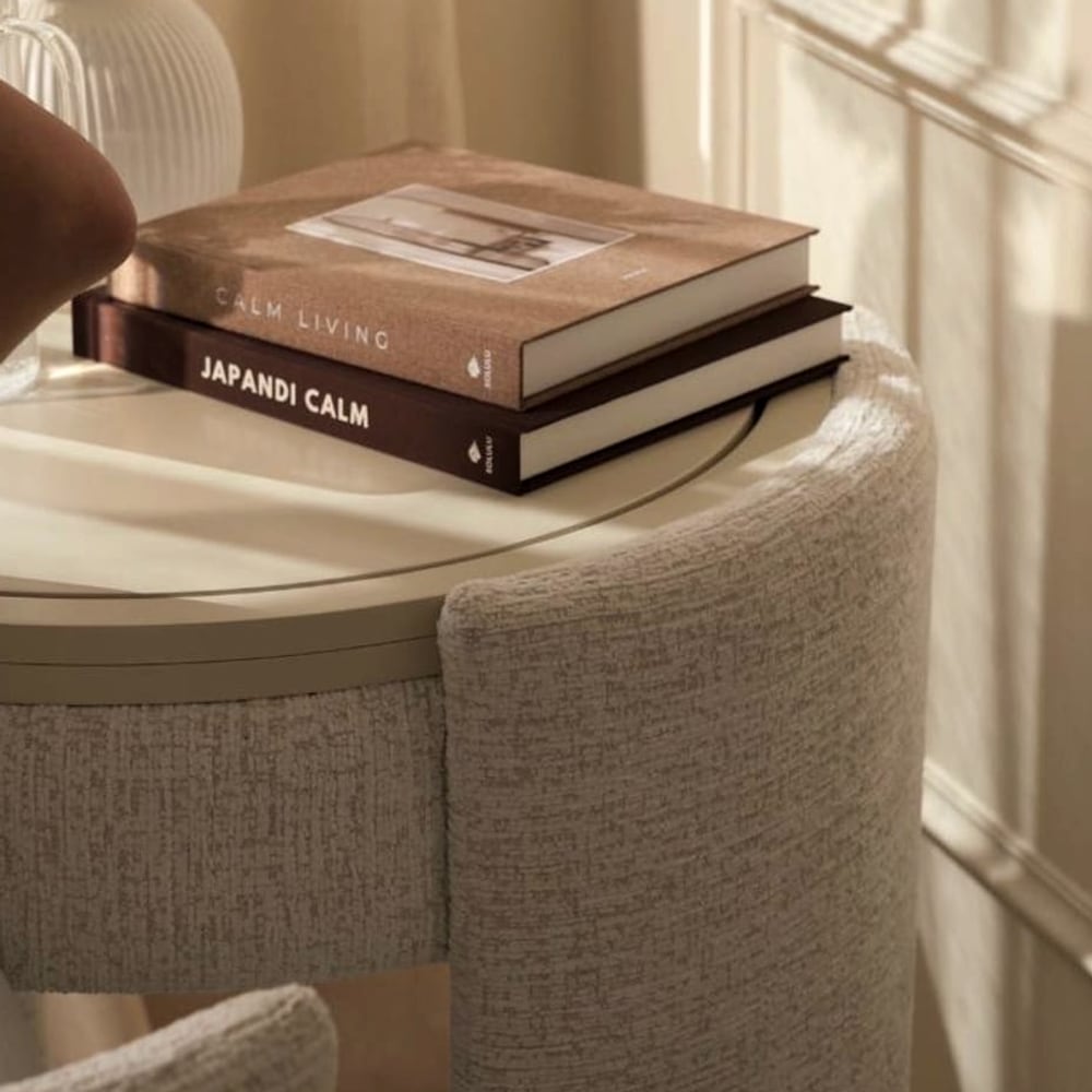 Closed, it reads as a small round side table